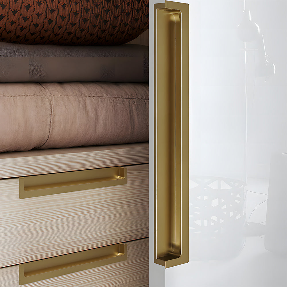 Bronze concealed slotted cabinet pull, shown from one angle installed on cabinetry in context
