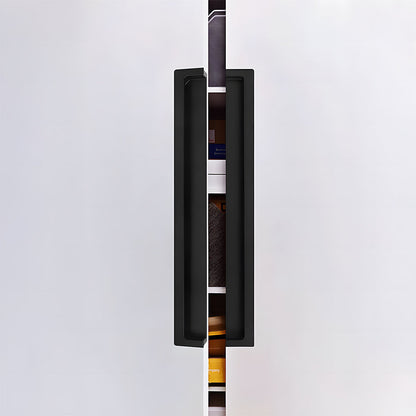 Black concealed slotted cabinet pull, shown clearly in an installed cabinet close-up