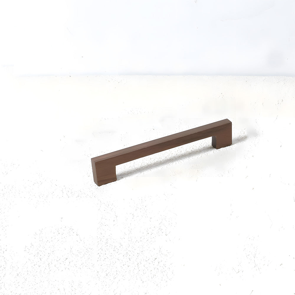 Square wood cabinet pull in black walnut with 160 mm centers, shown from a low angle with the wood face visible