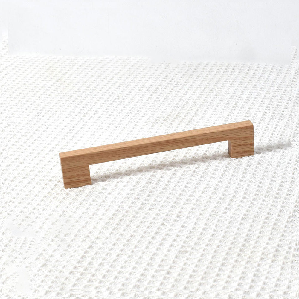 Square wood cabinet pull in oak, shown alone in a clean front view on a pale background