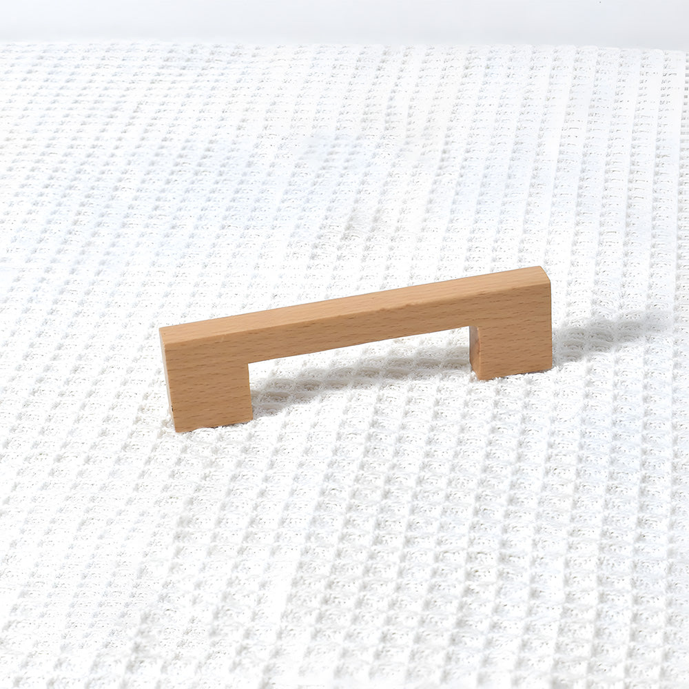 Square wood cabinet pull in beech with 96 mm centers, shown alone in a clean front view on a pale background