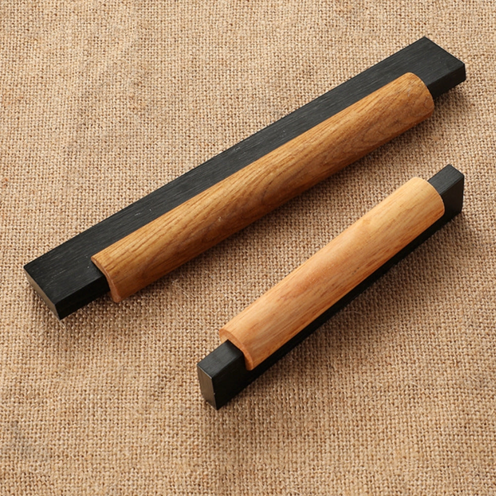 Wood cabinet pull with black or silver metal ends, arranged diagonally to show the visible materials and profiles