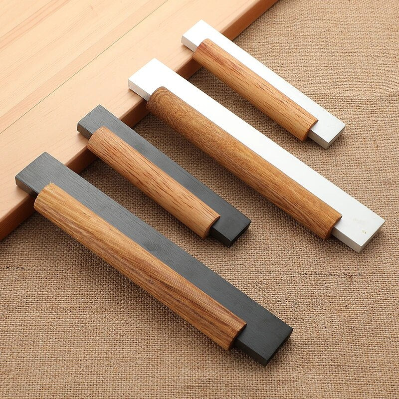 Wood cabinet pull with black or silver metal ends, arranged together for a size and style comparison
