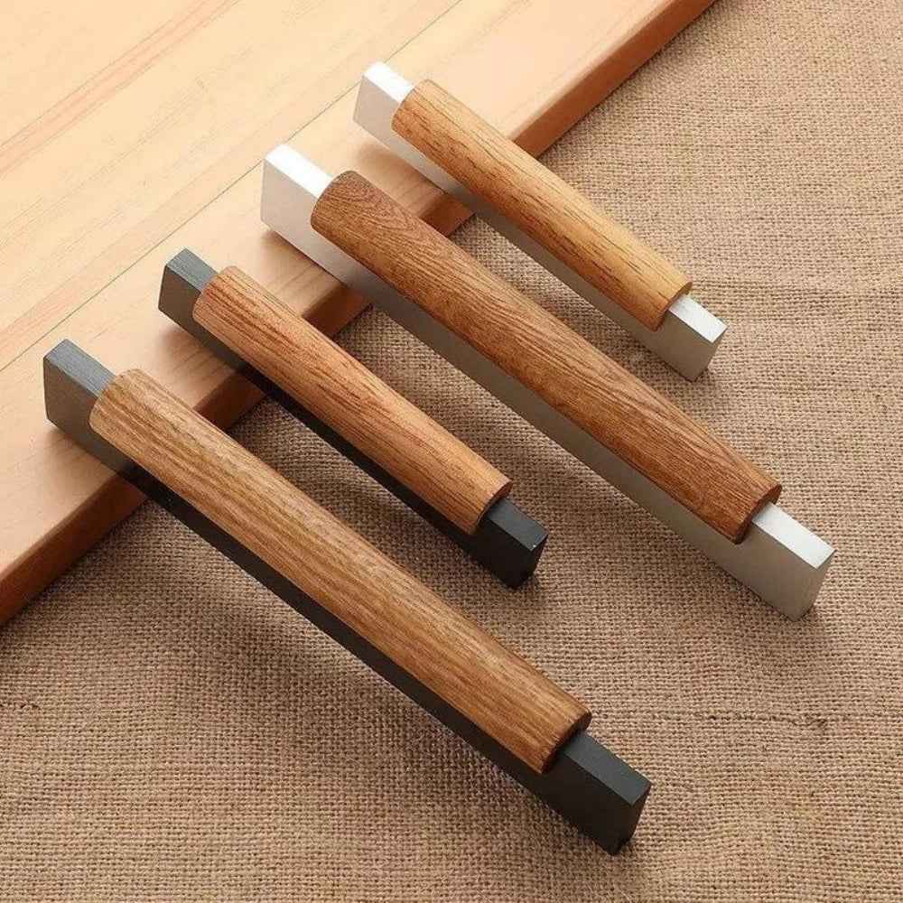 Wood cabinet pull with black or silver metal ends, grouped on a light surface to compare lengths and profiles