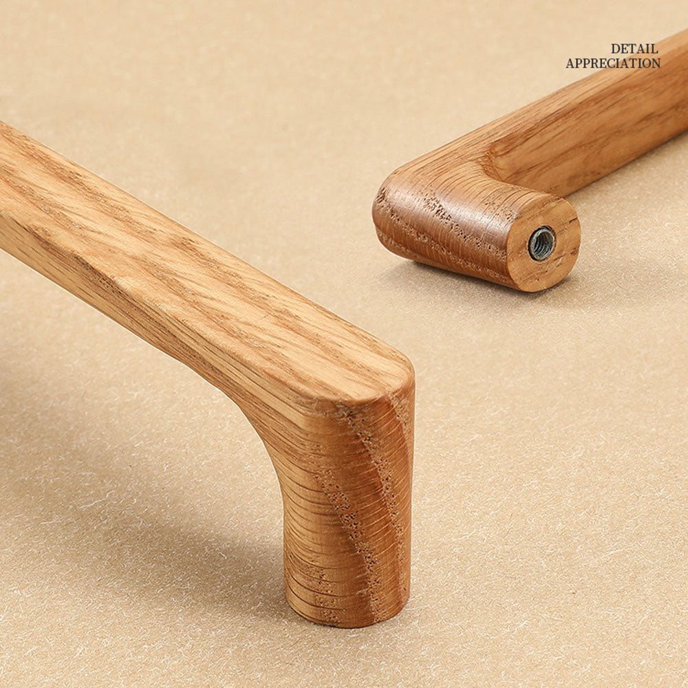 Natural wood cabinet pull with rounded corners, shown in side profile against a white cabinet surface