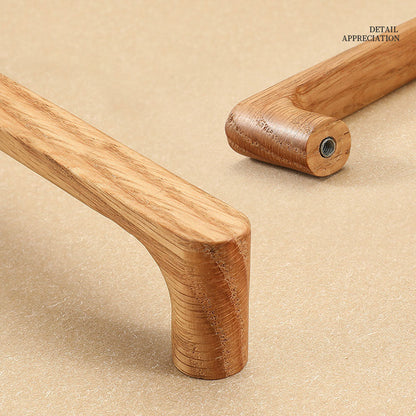 Natural wood cabinet pull with rounded corners, shown in side profile against a white cabinet surface