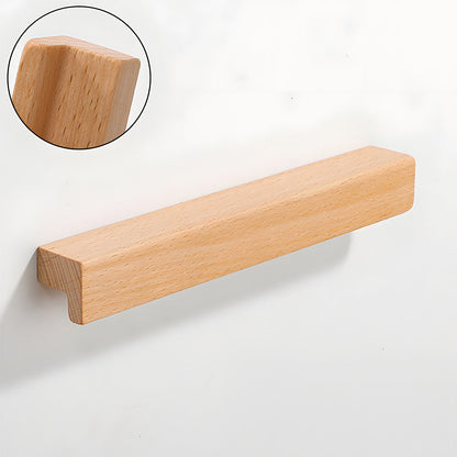Natural wood cabinet handle with an L-shaped profile, shown from a close side angle against a plain surface