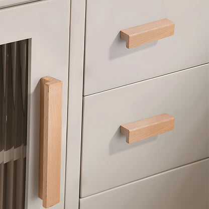 L-shaped wood cabinet handle in style A with 320 mm centers, installed on paired cabinet doors in a close view
