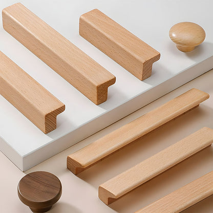 Natural wood cabinet handle with an L-shaped profile, grouped on a light surface to compare lengths and profiles