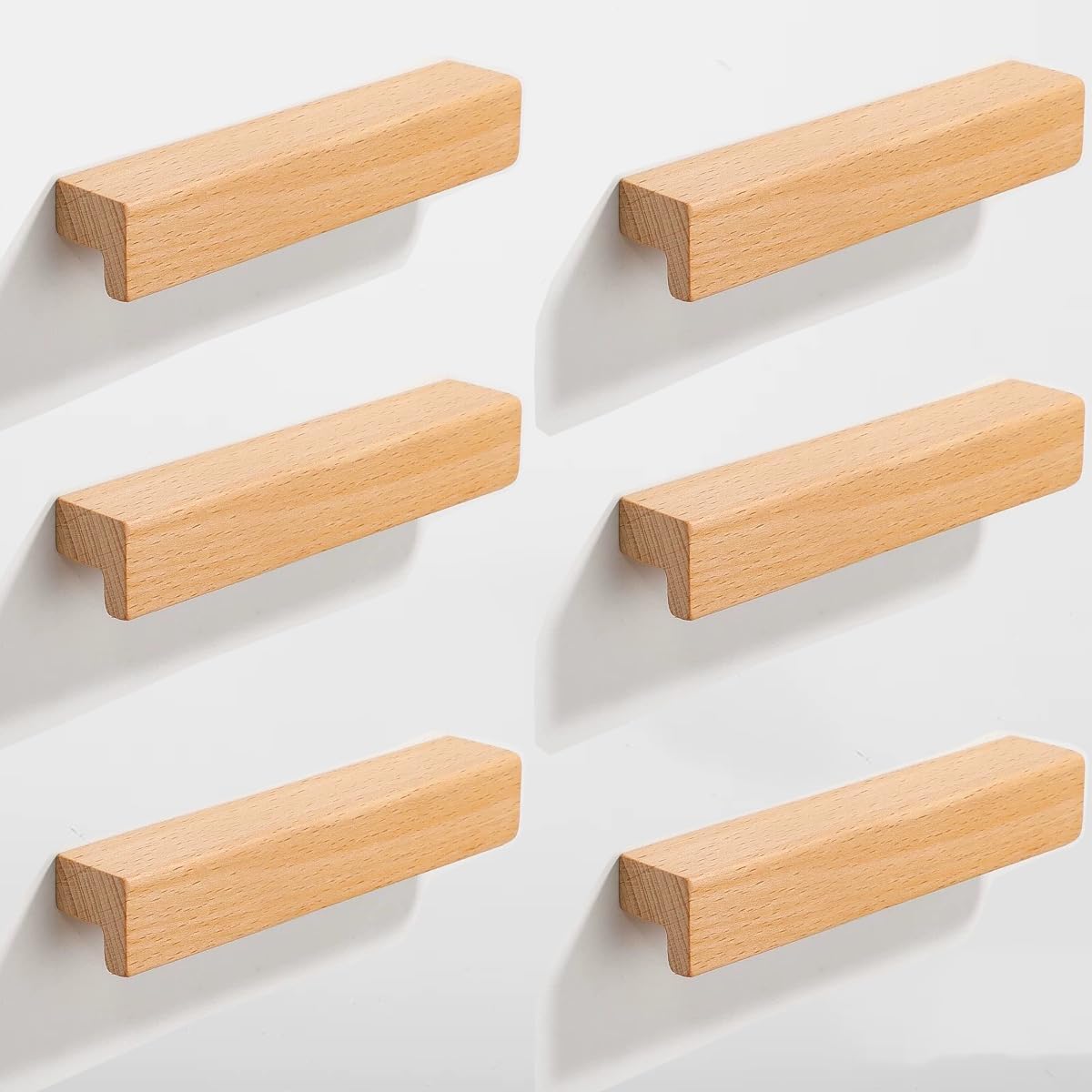 Natural wood cabinet handle with an L-shaped profile, arranged together from an overhead angle for comparison