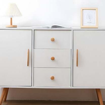 Tapered wood cabinet pull in natural wood with 96 mm centers, installed on a dresser or sideboard in a wider view