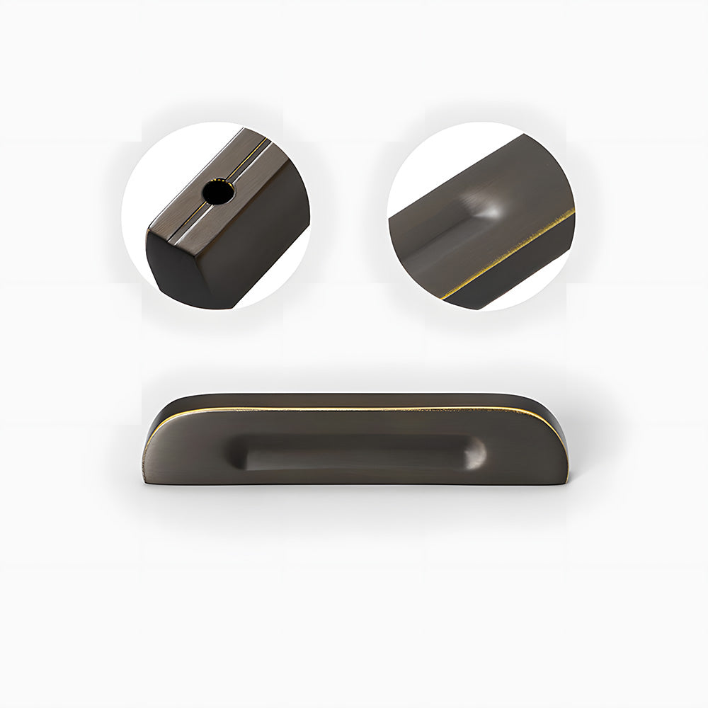 Recessed brass drawer pull with matching cabinet knob, shown in a focused view with its construction and finish visible