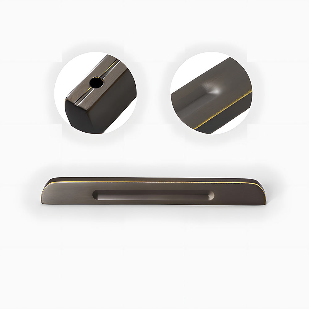 Recessed brass drawer pull with matching cabinet knob, shown clearly showing the surface and mounting form