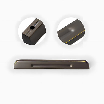Recessed brass drawer pull with matching cabinet knob, shown clearly showing the surface and mounting form