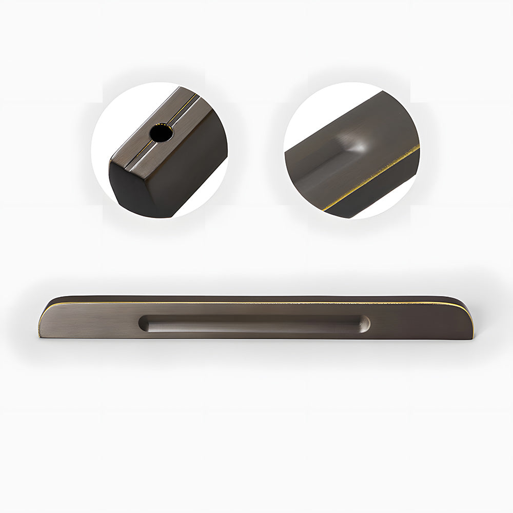 Recessed brass drawer pull with matching cabinet knob, shown from one angle showing the surface and mounting form