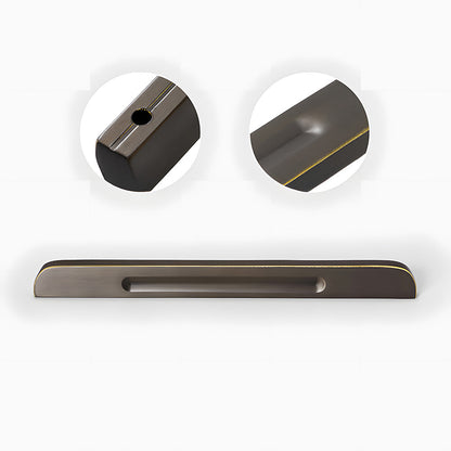 Recessed brass drawer pull with matching cabinet knob, shown from one angle showing the surface and mounting form