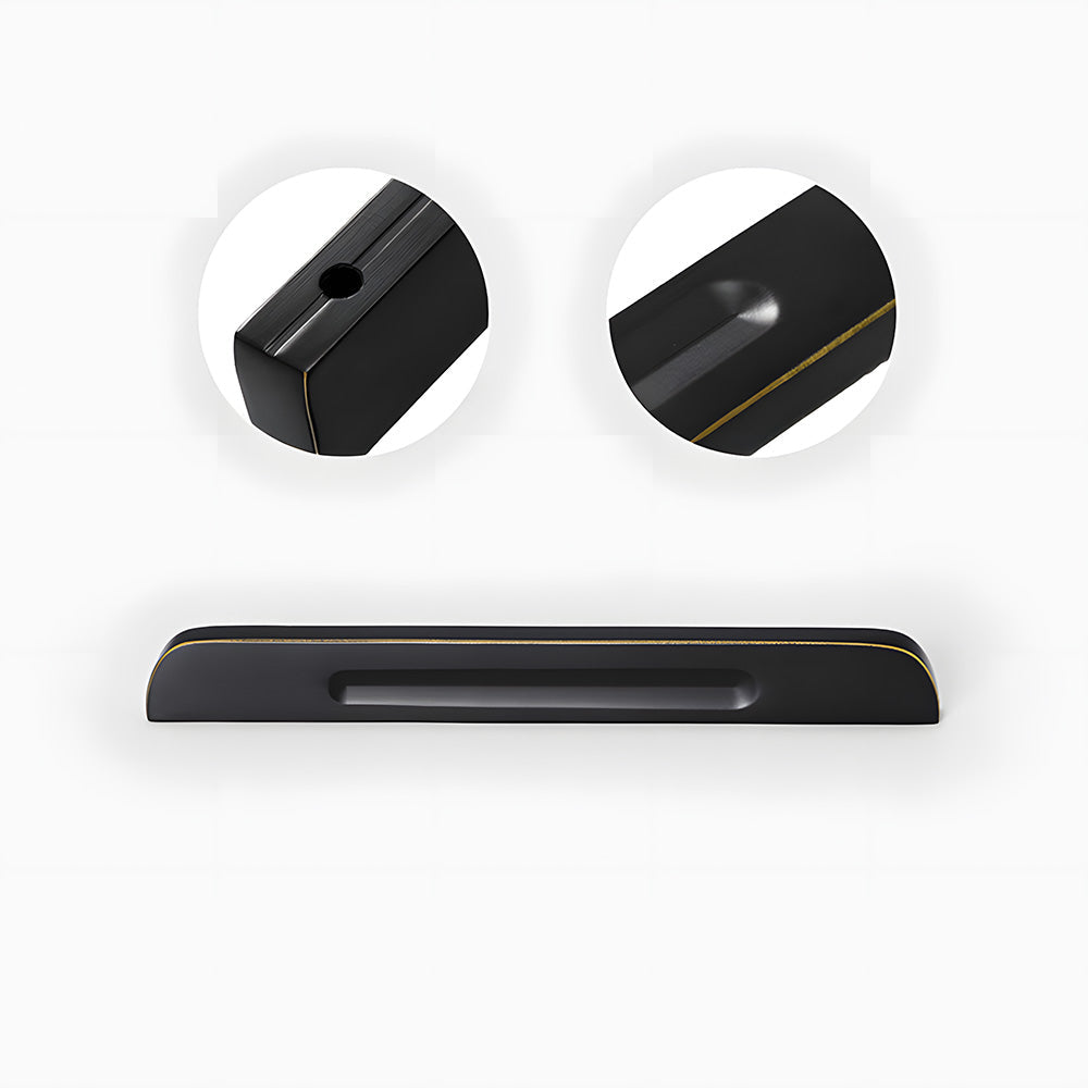 Recessed brass drawer pull with matching cabinet knob, shown at close range showing the surface and mounting form