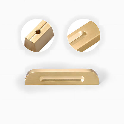 Recessed brass drawer pull with matching cabinet knob, shown from one angle with its construction and finish visible