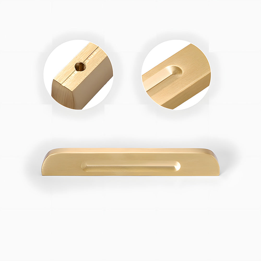 Recessed brass drawer pull with matching cabinet knob, pictured in one view with its construction and finish visible