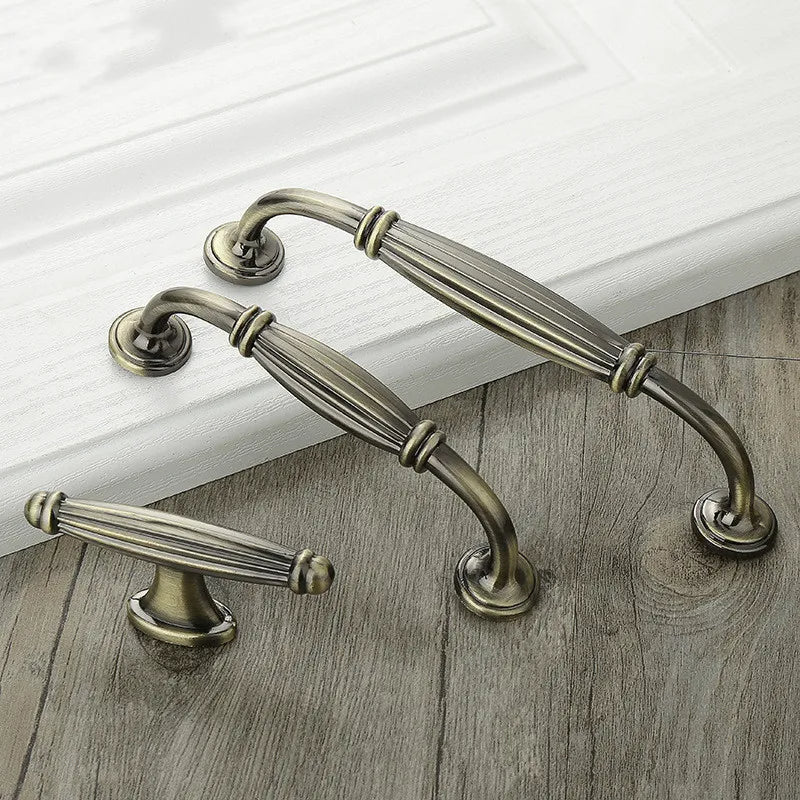 Retro fluted cabinet pull with matching T-bar knob, shown in a focused view as a color and finish lineup