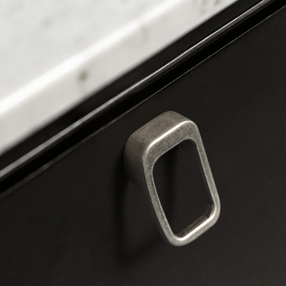 Rounded rectangle cabinet pull, shown clearly in an installed cabinet close-up with key hardware details visible