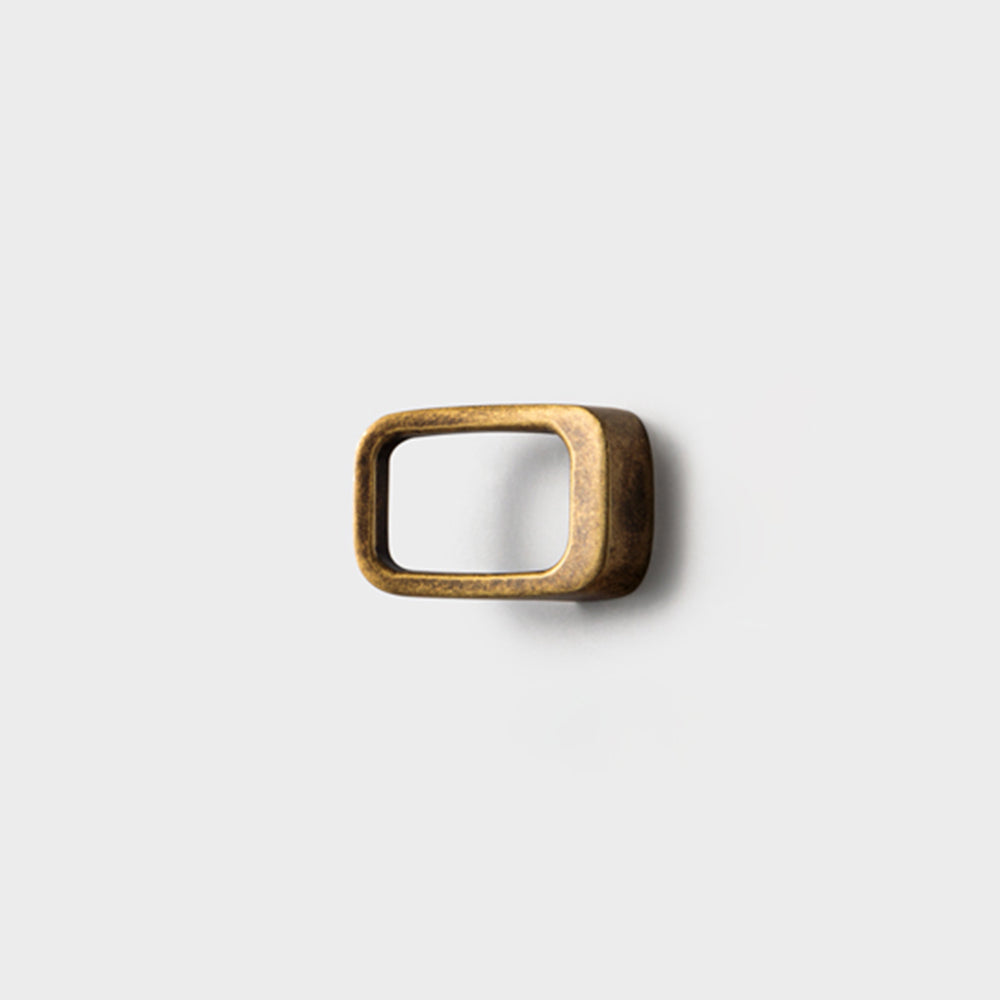 Rounded rectangle cabinet pull, shown from one angle on a clean neutral background