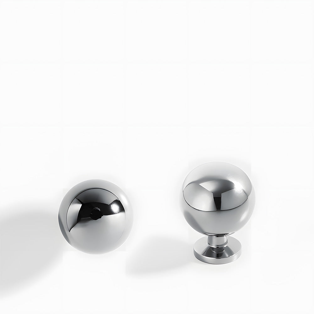 Silver retro shell cup pull and round knob, shown from one angle with its shape and finish visible