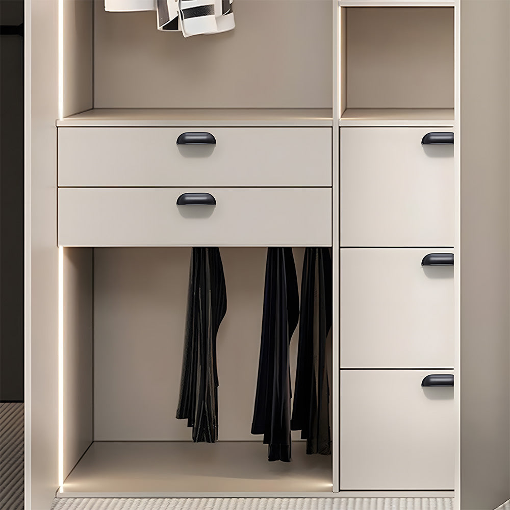 Black retro shell cup pull and round knob, shown in a focused view installed on cabinetry in context