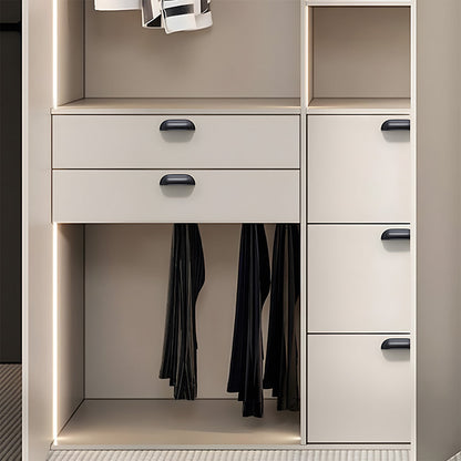 Black retro shell cup pull and round knob, shown in a focused view installed on cabinetry in context