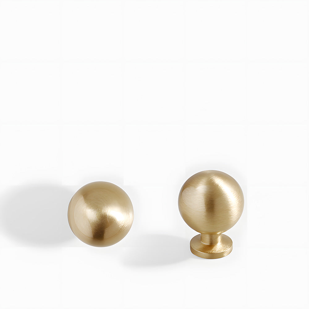 Brushed gold retro shell cup pull and round knob, shown from one angle on a clean neutral background