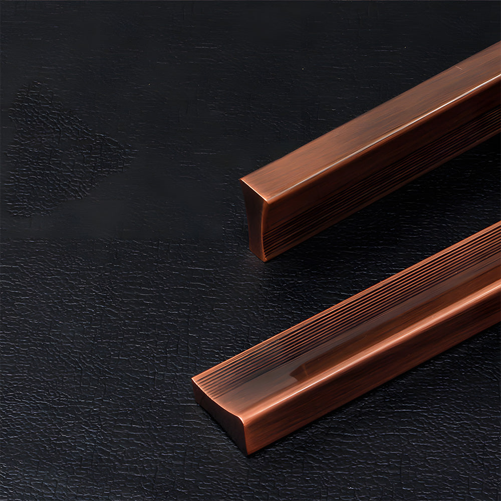 Ribbed retro recessed cabinet pull, shown from one angle with its construction and finish visible