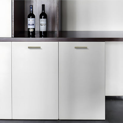 Antique bronze ribbed retro recessed cabinet pull, displayed from the side installed on cabinetry in context