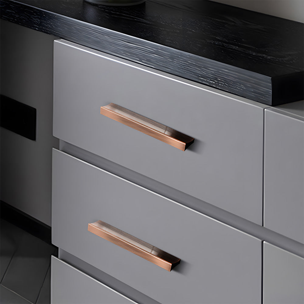 Red bronze ribbed retro recessed cabinet pull, shown clearly installed on cabinetry in context