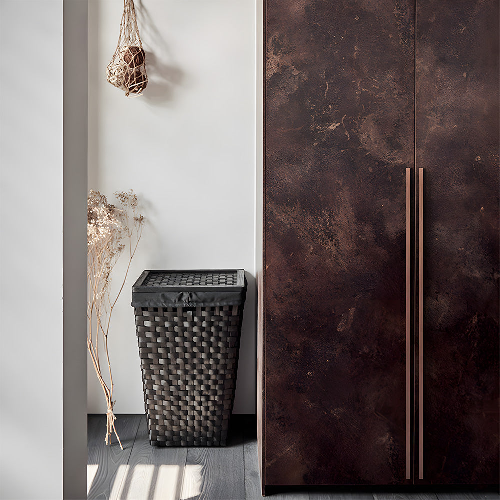 Red bronze ribbed retro recessed cabinet pull, shown from one angle installed on cabinetry in context