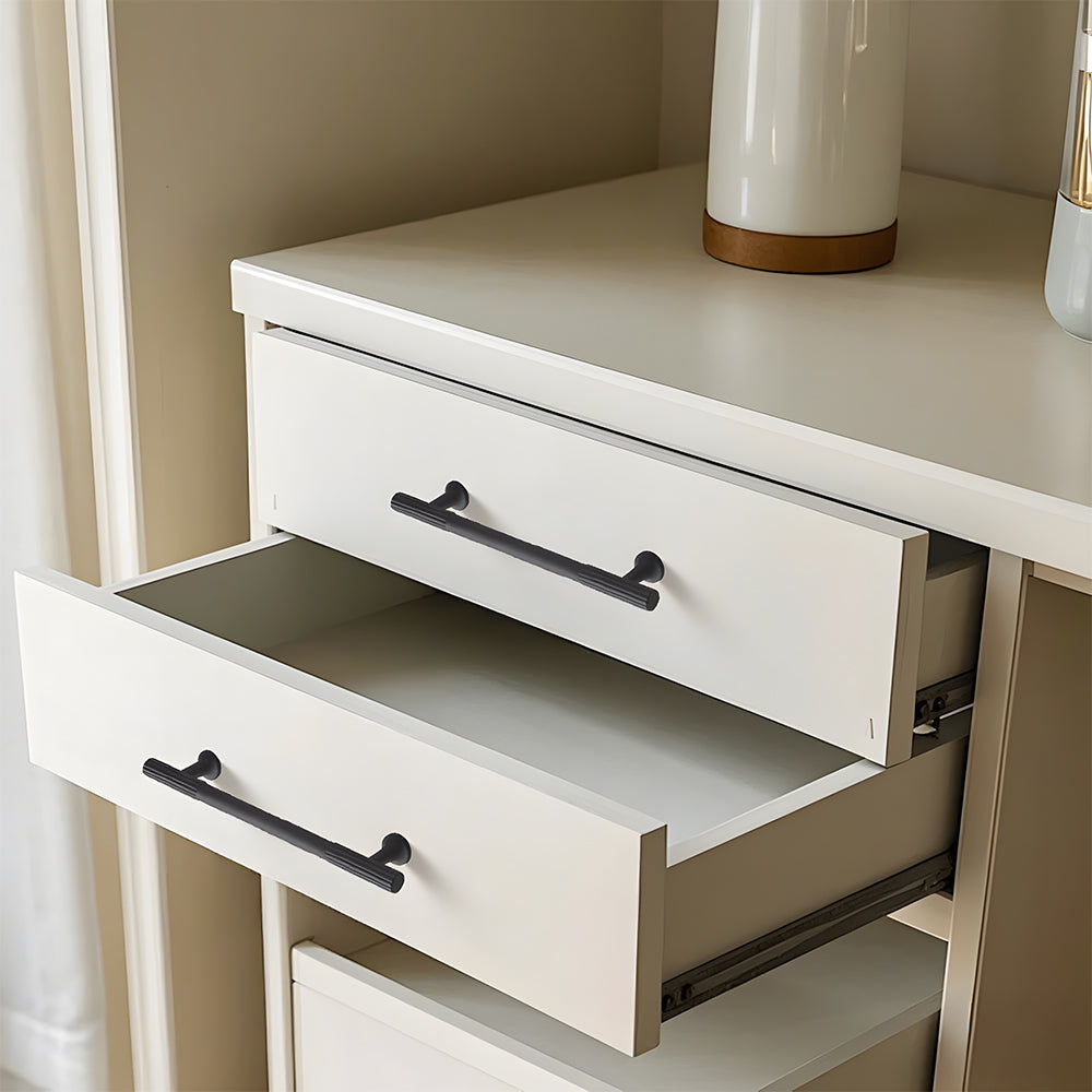 Black ribbed bar cabinet pull and round knob, presented for reference installed on cabinetry in context