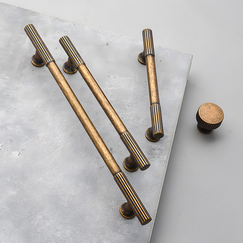 Ribbed bar cabinet pull and round knob, shown at close range as a color and finish lineup