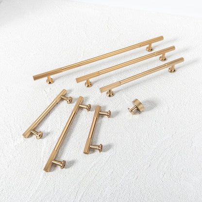 Matte gold ribbed bar cabinet pull and round knob, shown in a focused view as a color and finish lineup
