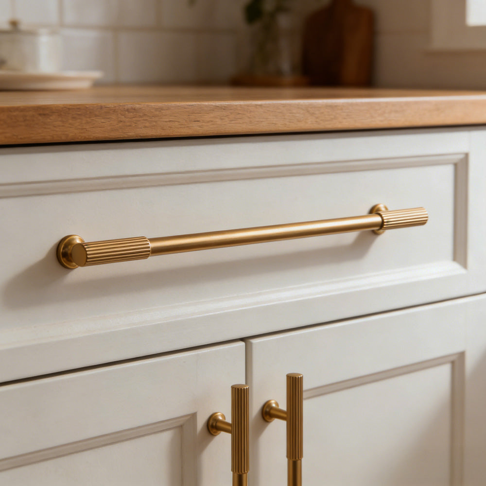 Ribbed bar cabinet pull and round knob, shown from one angle with the finish and grip area visible