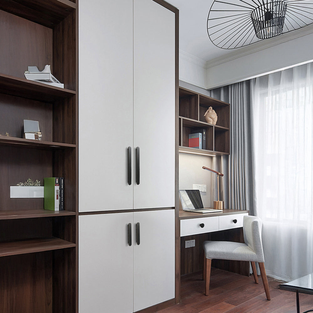 Black rounded-edge brass cabinet pull and round knob, displayed from the side installed on cabinetry in context
