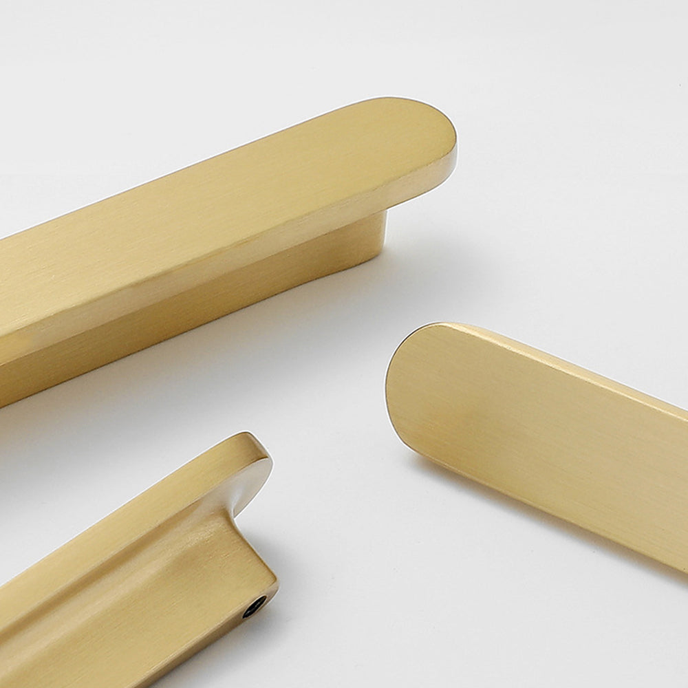Rounded-edge brass cabinet pull and round knob, shown clearly with its construction and finish visible