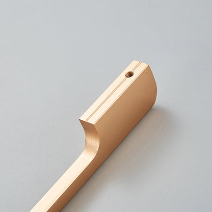 Close-up of the threaded mounting hole and curved underside on a champagne bronze cabinet pull