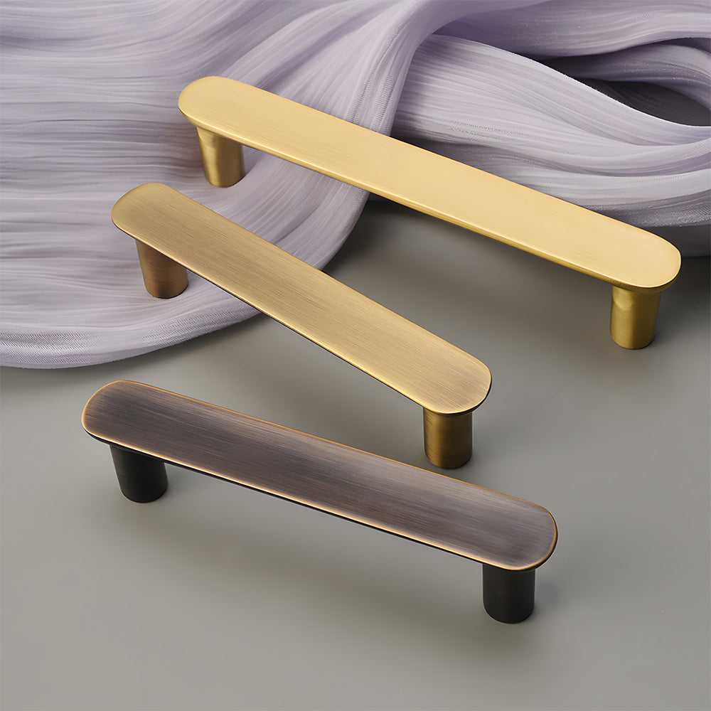 Brass rounded bar cabinet pull, shown from one angle as a color and finish lineup