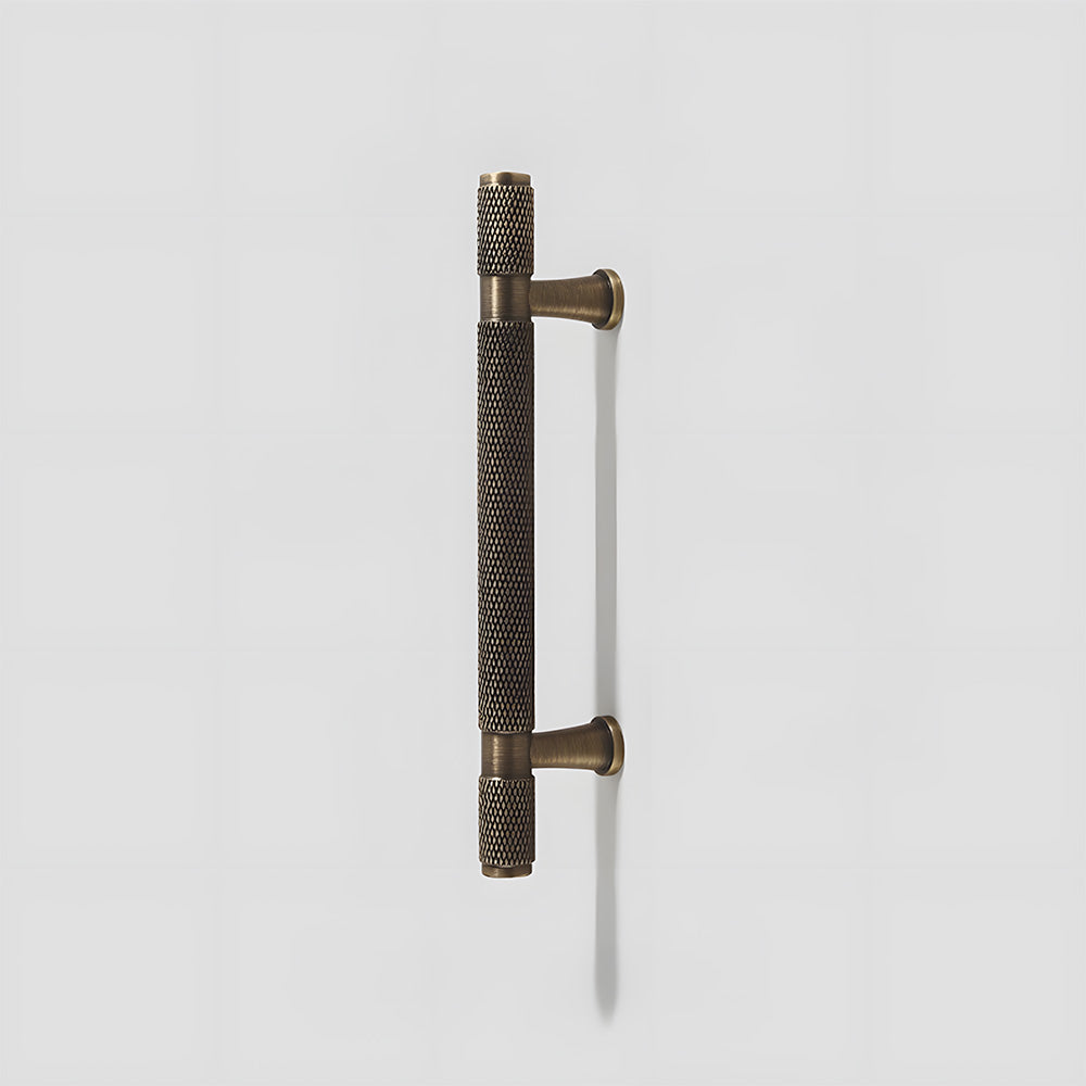 Knurled brass T-bar cabinet pull, pictured in one view on a clean neutral background