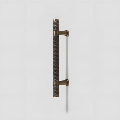 Knurled brass T-bar cabinet pull, pictured in one view on a clean neutral background