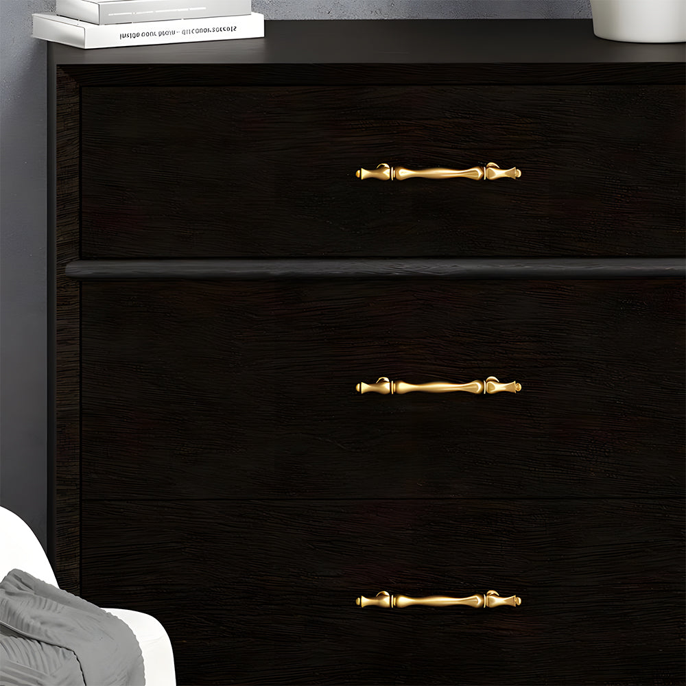 Gold brass twisted cabinet pull and knobs, displayed from the side installed on cabinetry in context