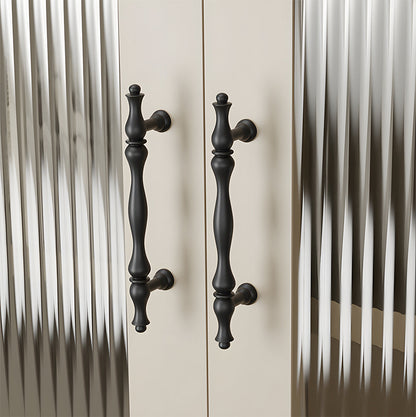 Black brass twisted cabinet pull and knobs, presented in another view installed on cabinetry in context
