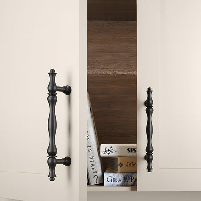 Black brass twisted cabinet pull and knobs, shown clearly mounted on a finished cabinet front