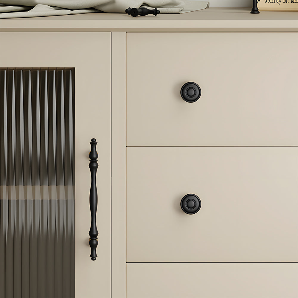 Brass twisted cabinet pull and knobs, pictured in one view mounted on a finished cabinet front