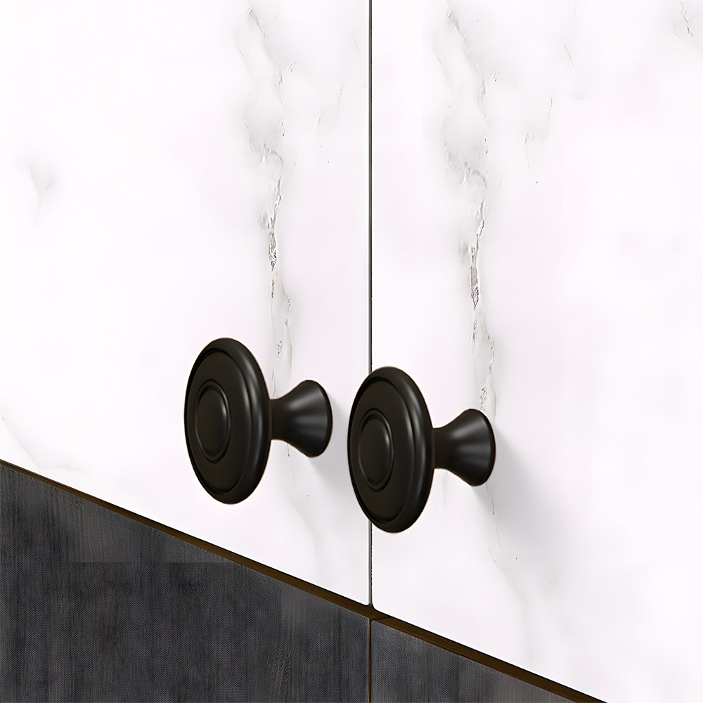 Black brass twisted cabinet pull and knobs, presented for reference mounted on a finished cabinet front