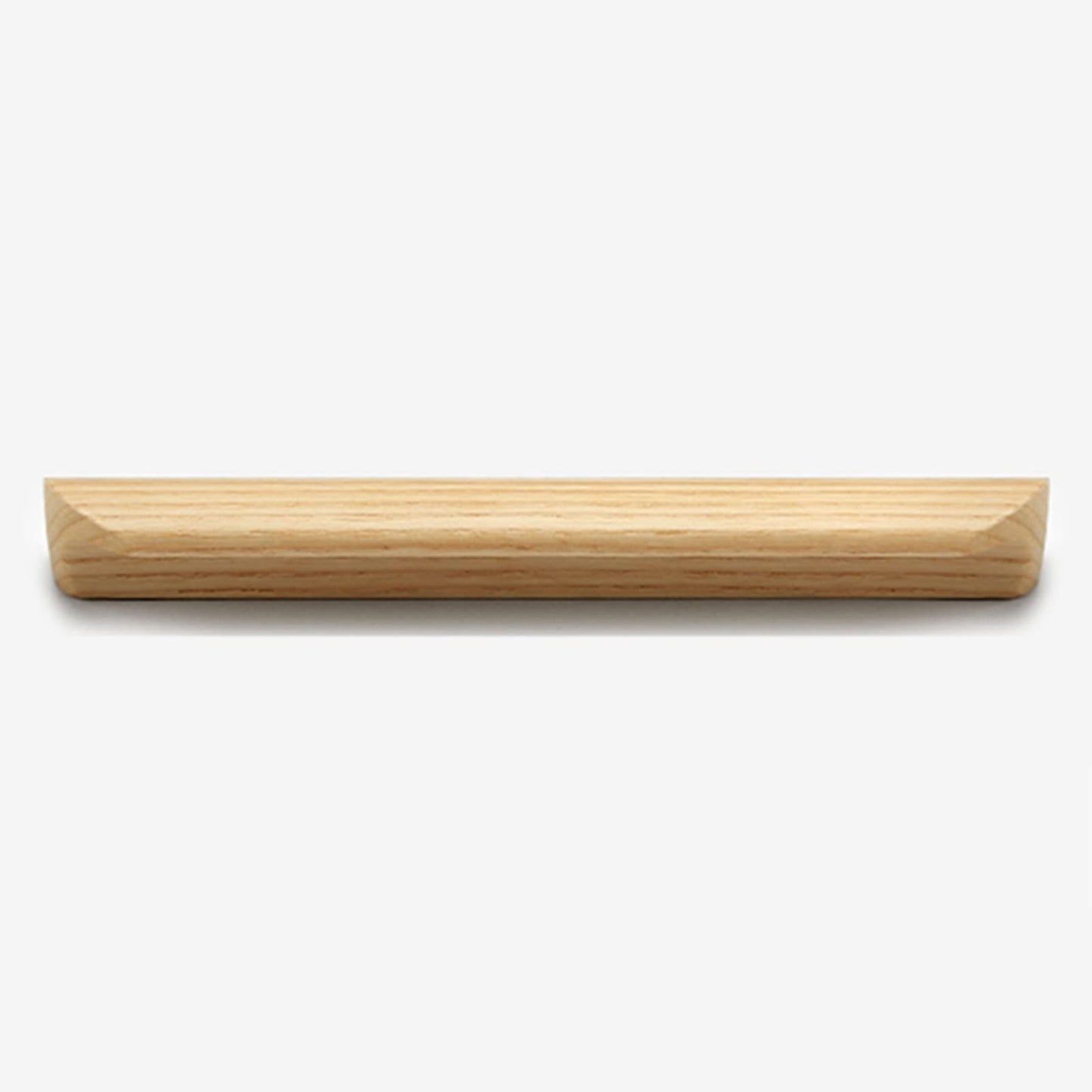 Solid beech wood half-round cabinet finger pull, shown from a close side angle against a plain surface